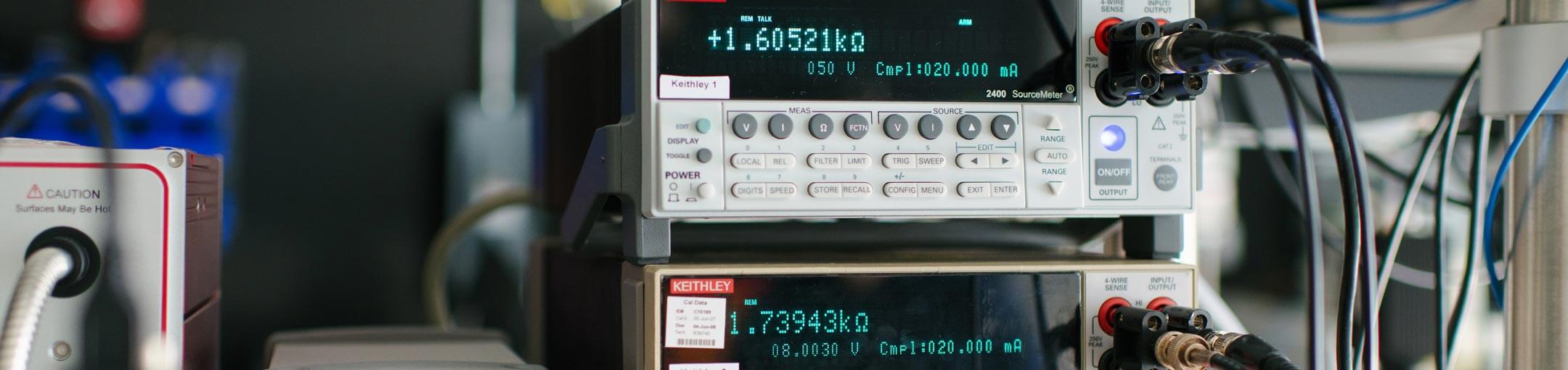 Close up of cords connected to a sourcemeter.