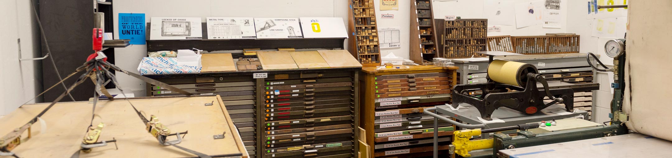 Studio with metal print blocks and print press visible