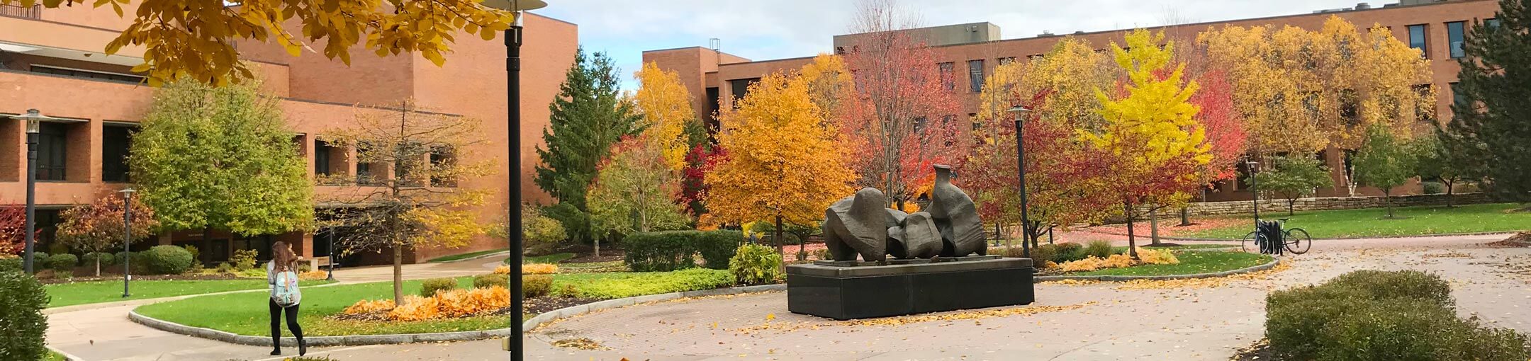 A large outdoor sculpture on campus during Autumn.