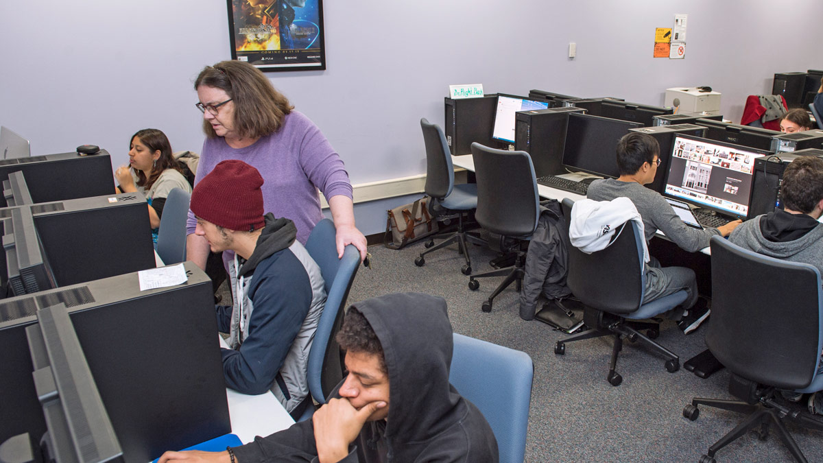 Several students working in a computer lab.