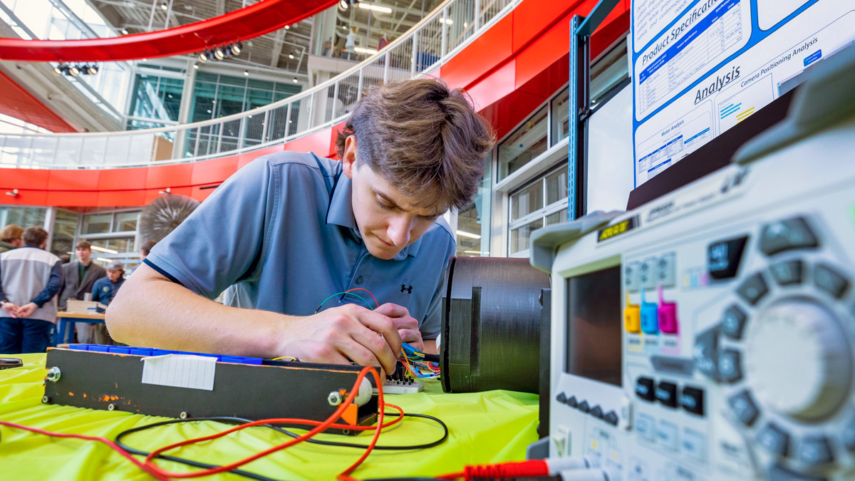 A student works on an electronics project.