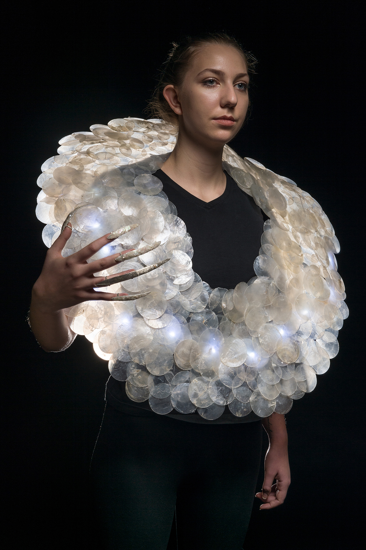 A wearable sculpture modeled by a student