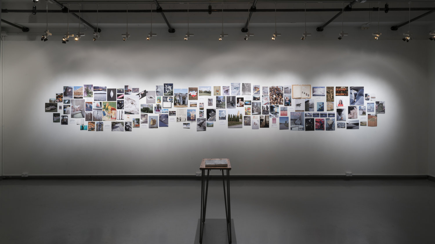 A display of photographs in RIT's William Harris Gallery