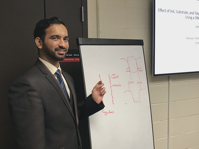 Mihir Choudari presents his thesis for his master's degree in print media.