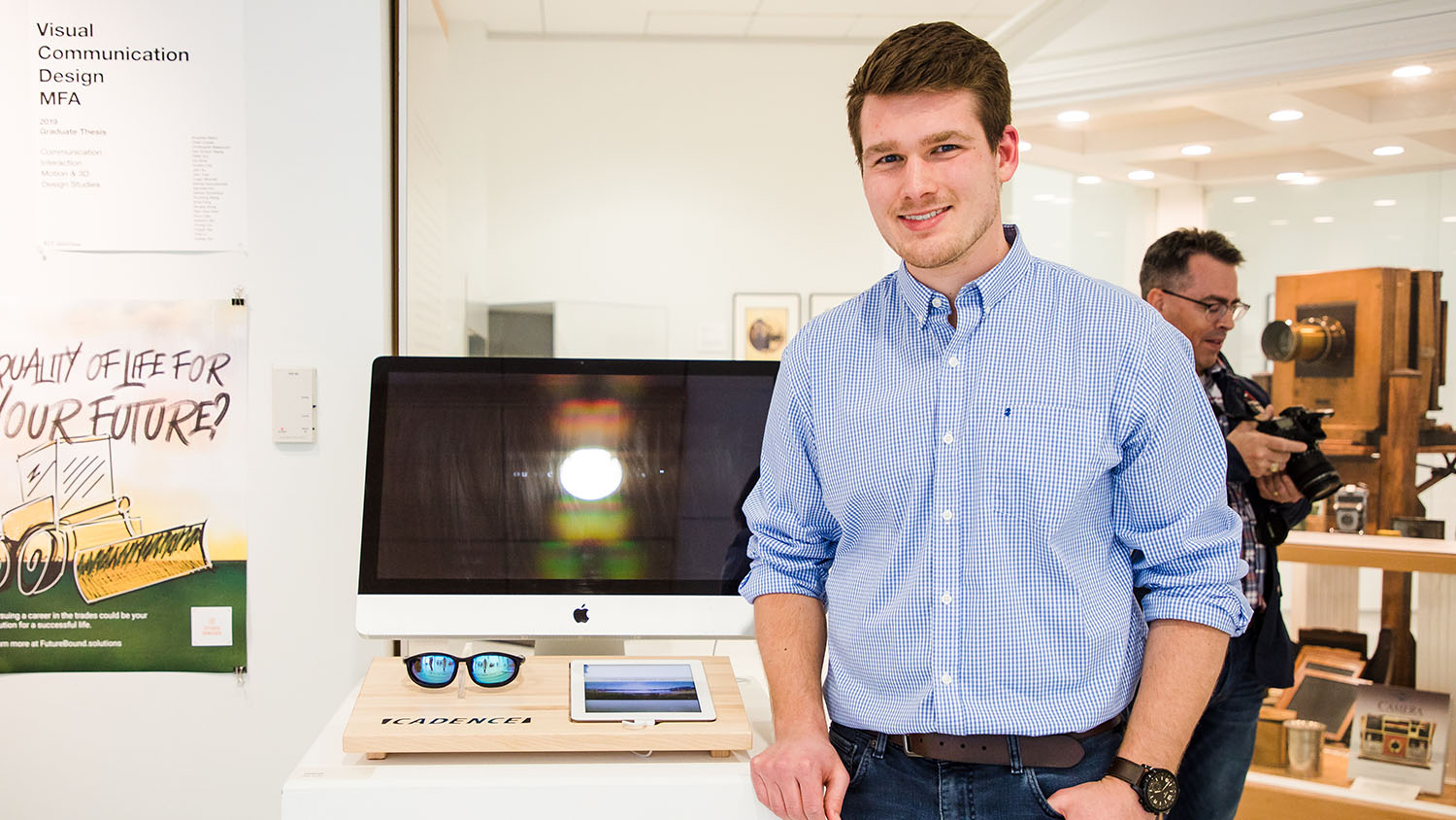 Chad Cooper shows off his thesis exhibit