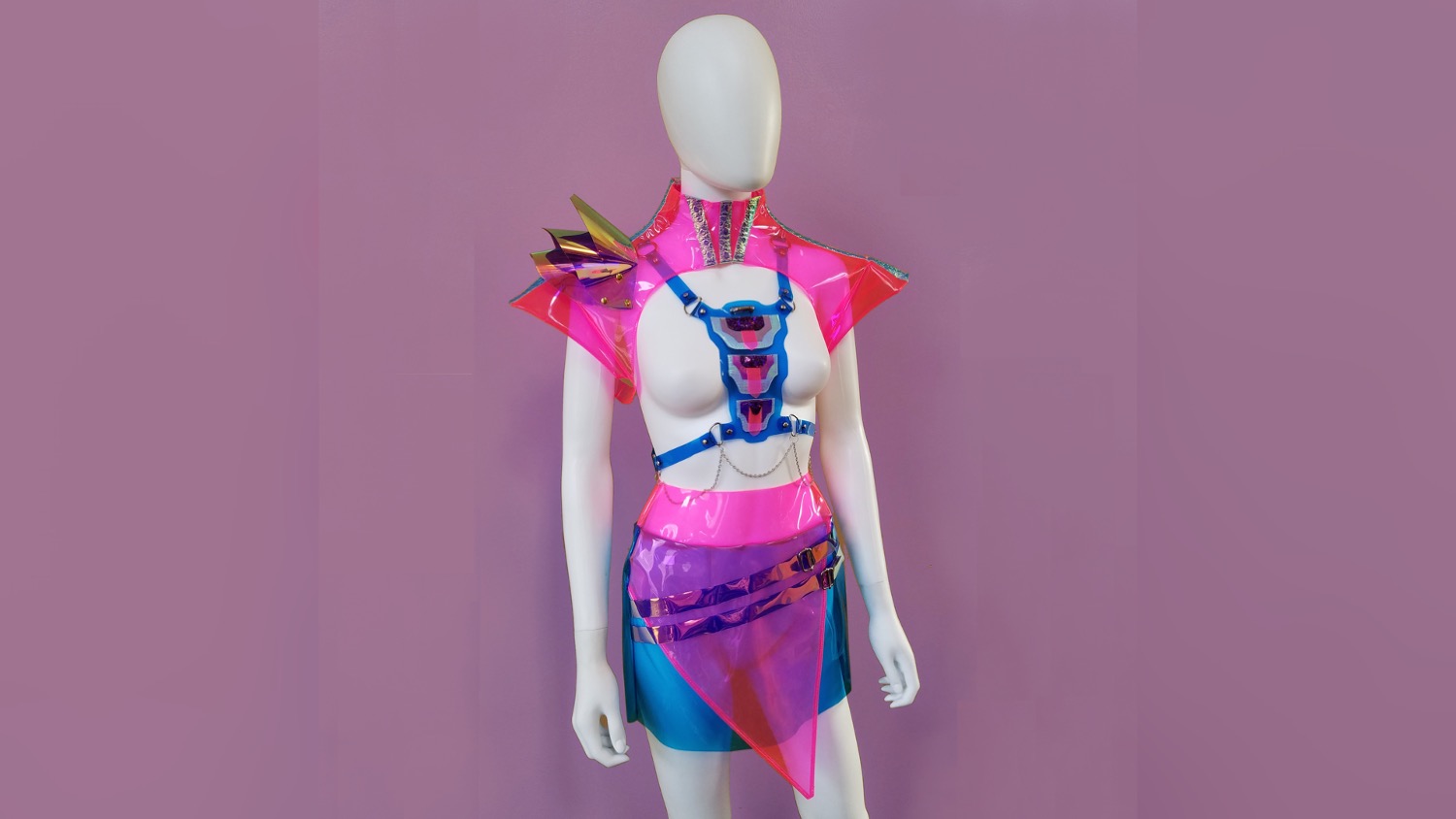 Vibrant clothing designs on a mannequin, part of an avant-garde fashion design line.