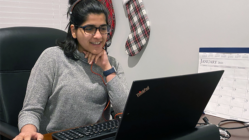 Shivani Phadke sitting in front of her laptop