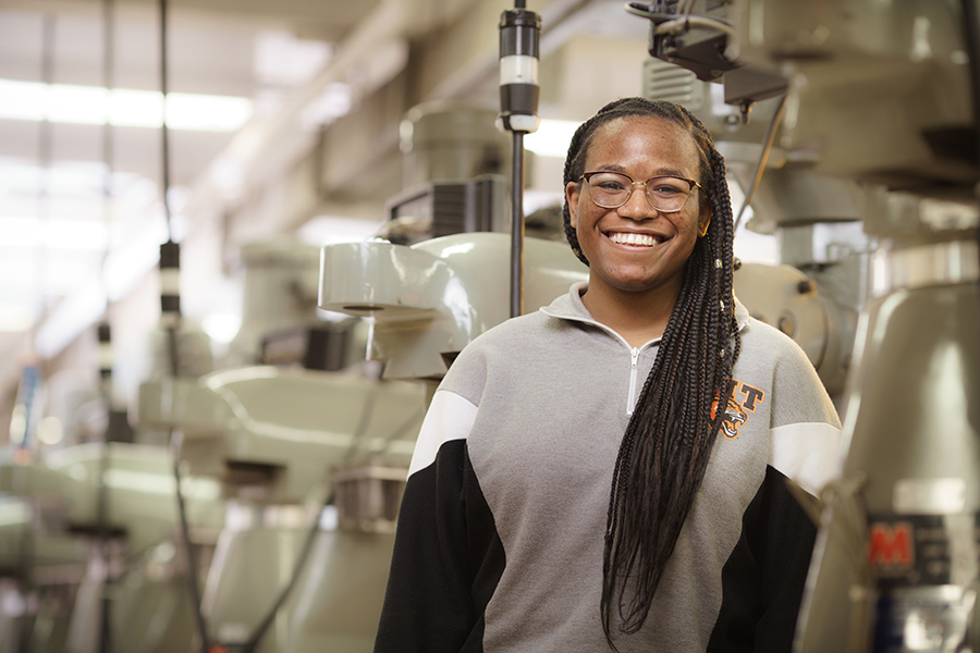 A portrait of RIT student, Symonne Francis, wearing a RIT sweatshirt.