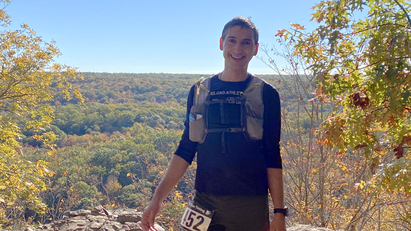 Mark Cicero standing on top of a mountain