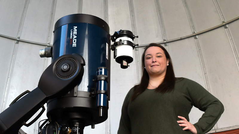 Brittany Vanderhoof standing in the RIT Observatory