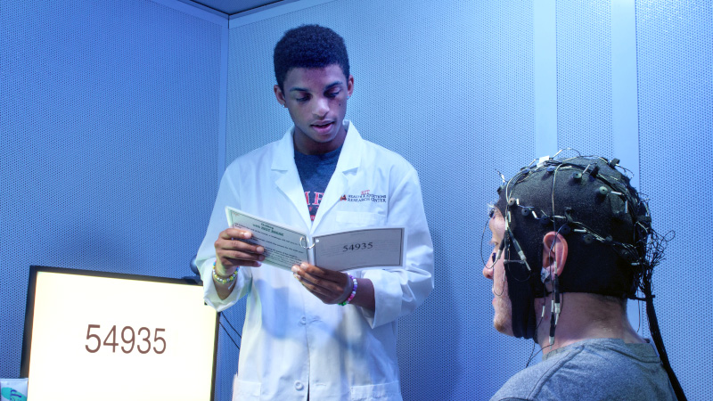 neuroscience student working with patient 