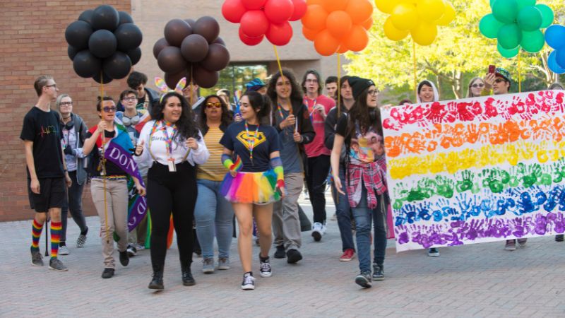 photo of students walking in pride march