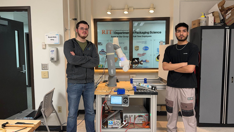 Mechanical and Manufacturing Engineering Technology, MMET, student team at RIT with ABB robot, demonstrating their surface detect and repair robotics project