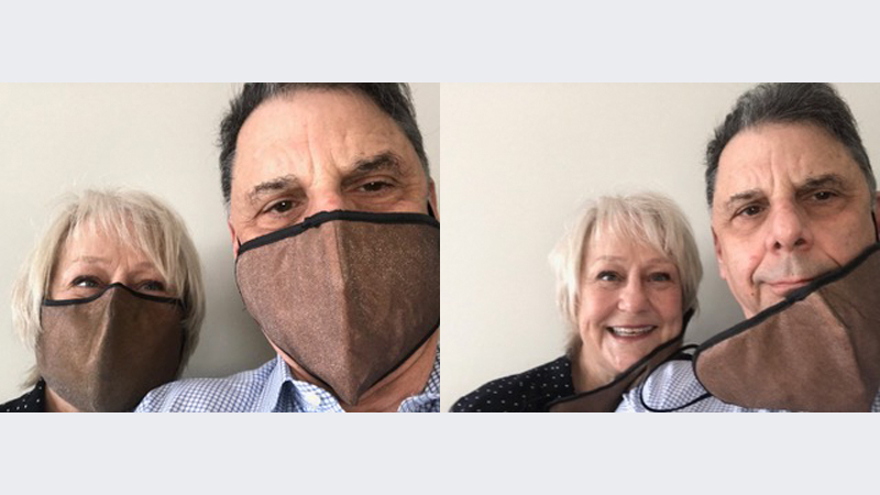 Ken Reed and his wife wearing masks