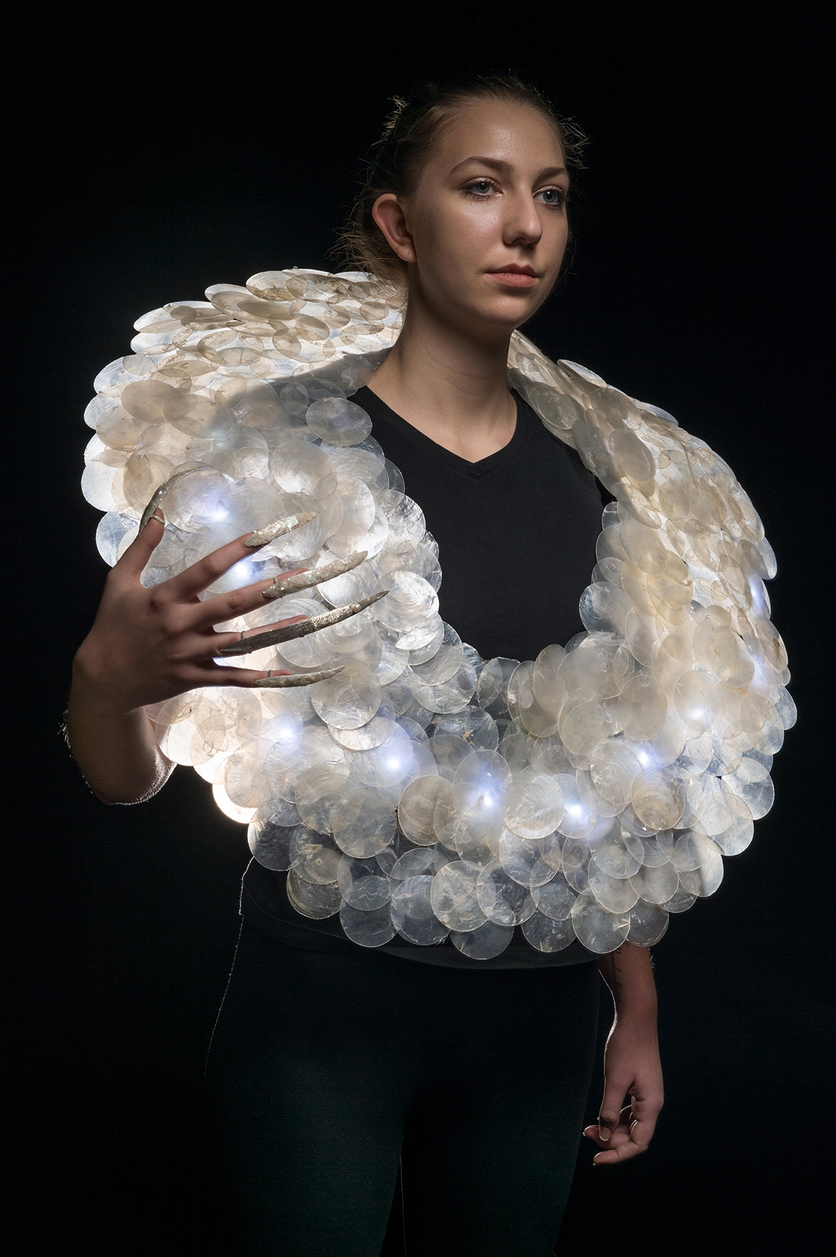 A wearable sculpture modeled by a student.