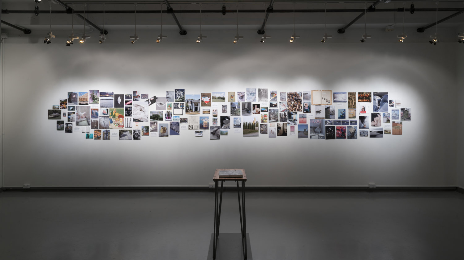 A display of photographs in RIT's William Harris Gallery.