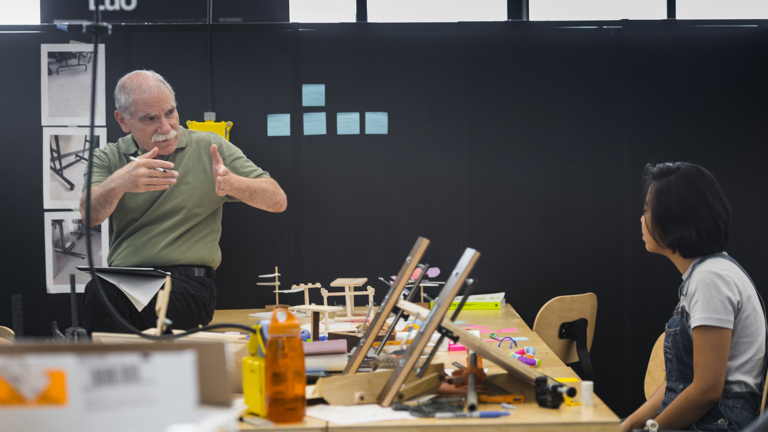 Studio 930 manager Dan Harel works in the industrial design studio with a student.