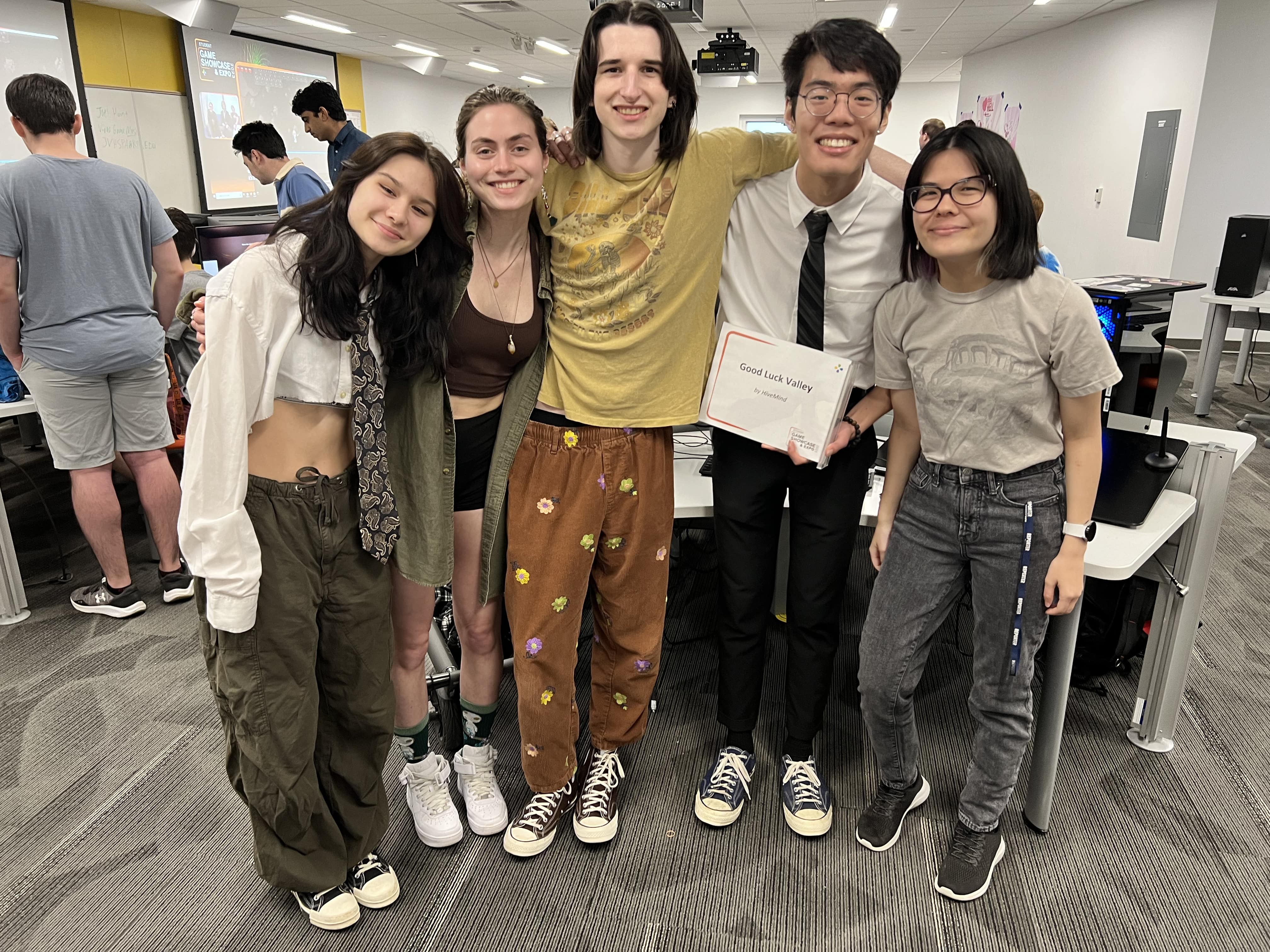 group of students posing in a lab smiling with a certificate