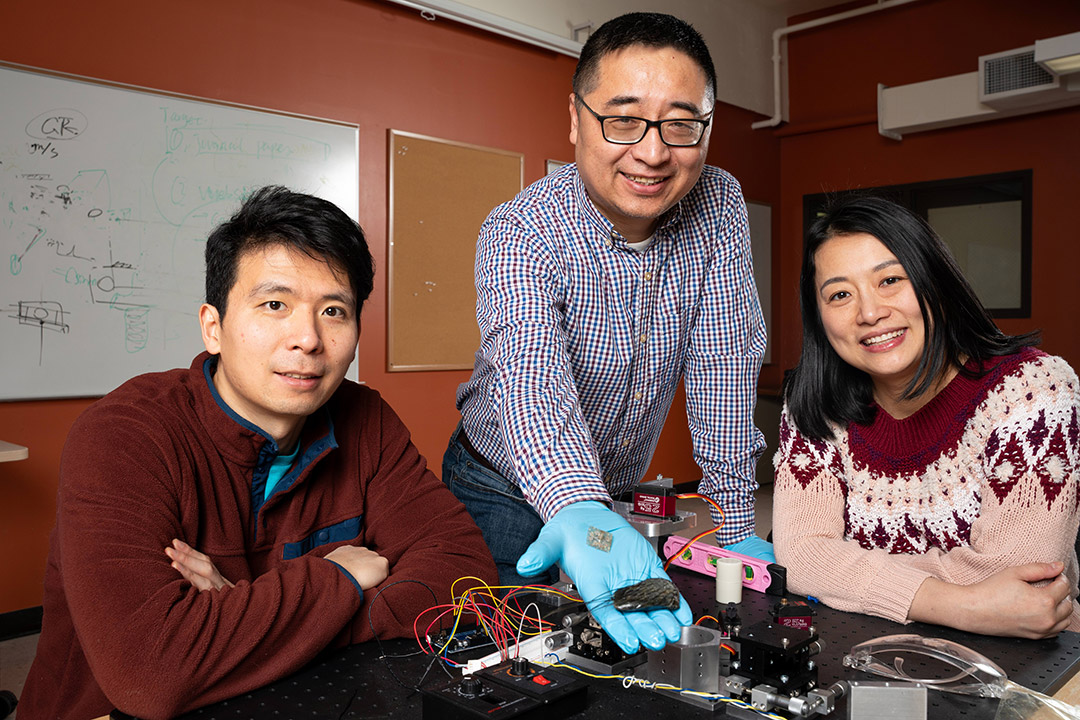 From left to right, engineering faculty researchers Dongfang Liu, Xudong Zheng, and Qian Xue display the seal whisker specimen they are modeling their advanced sensor array on for improving underwater detection and recognition.