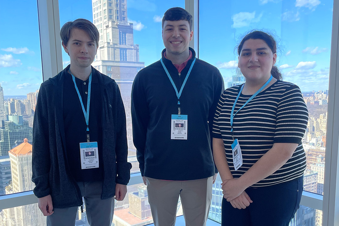 3 RIT students in front of NYC skyline