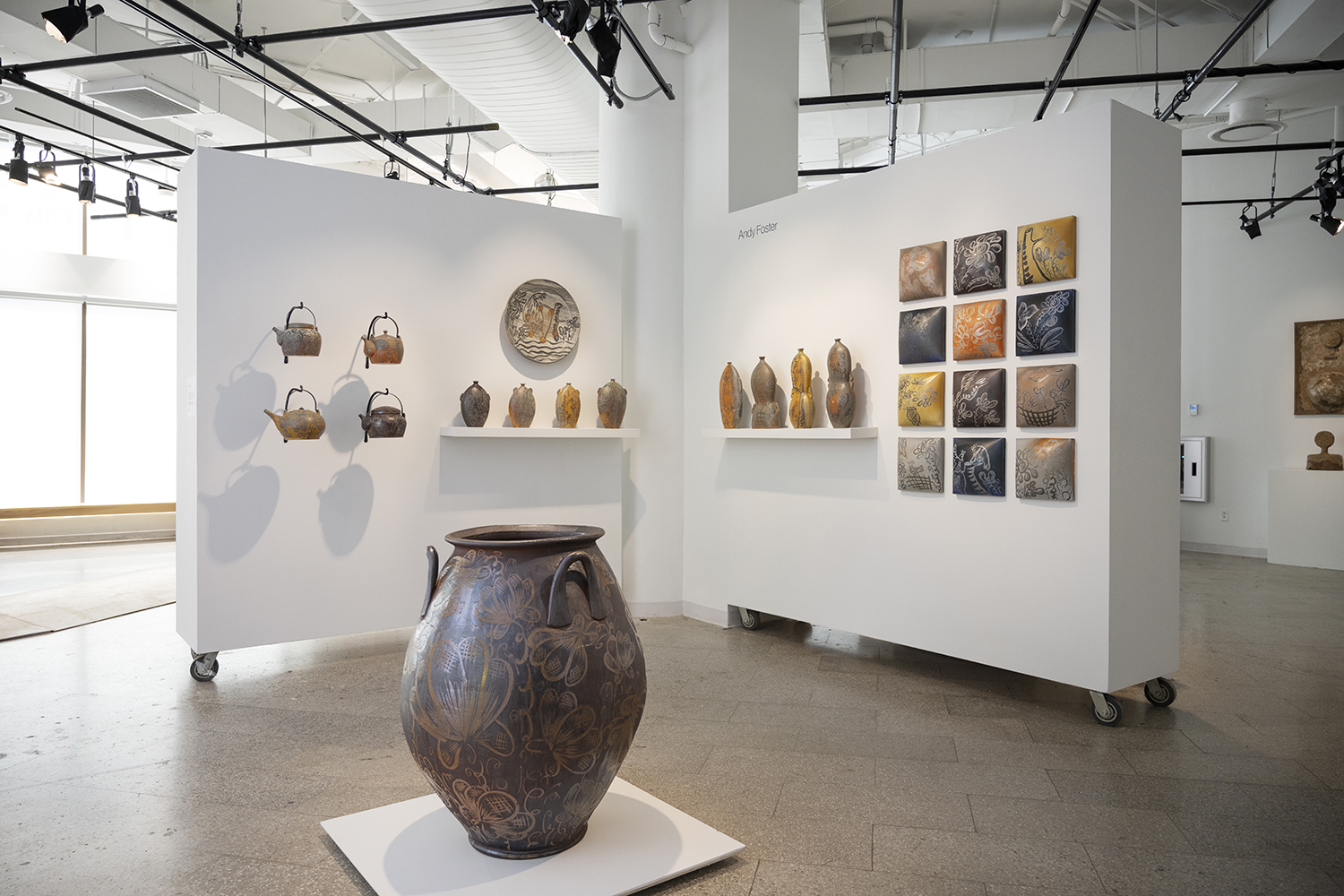 A gallery installation view of pottery made by Andy Foster.