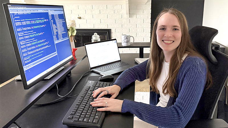 Kimberly Dautel working at her computer at home