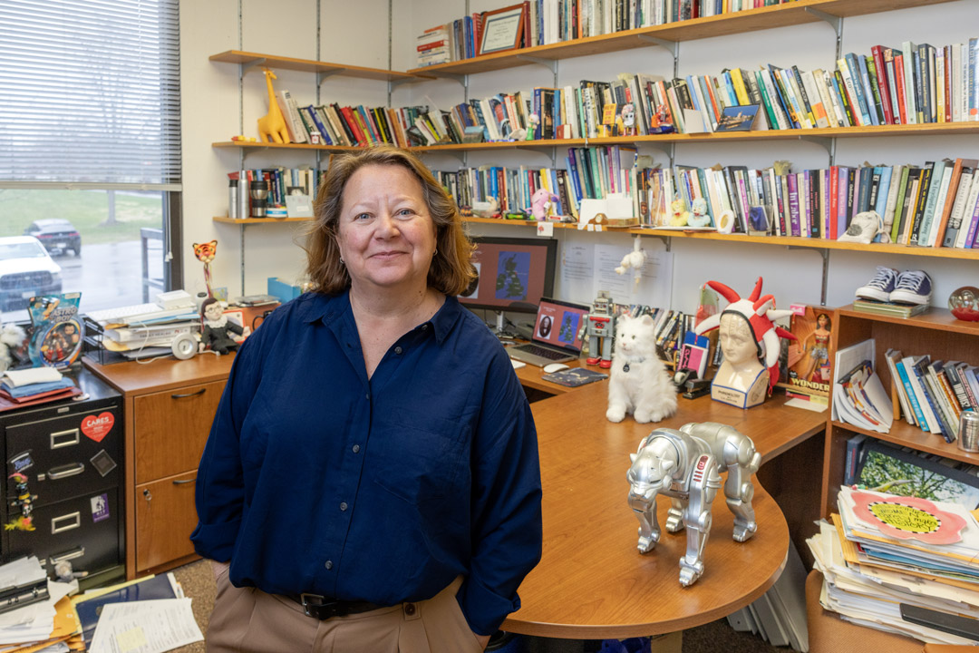 Professor Deborah Blizzard stands in her RIT office