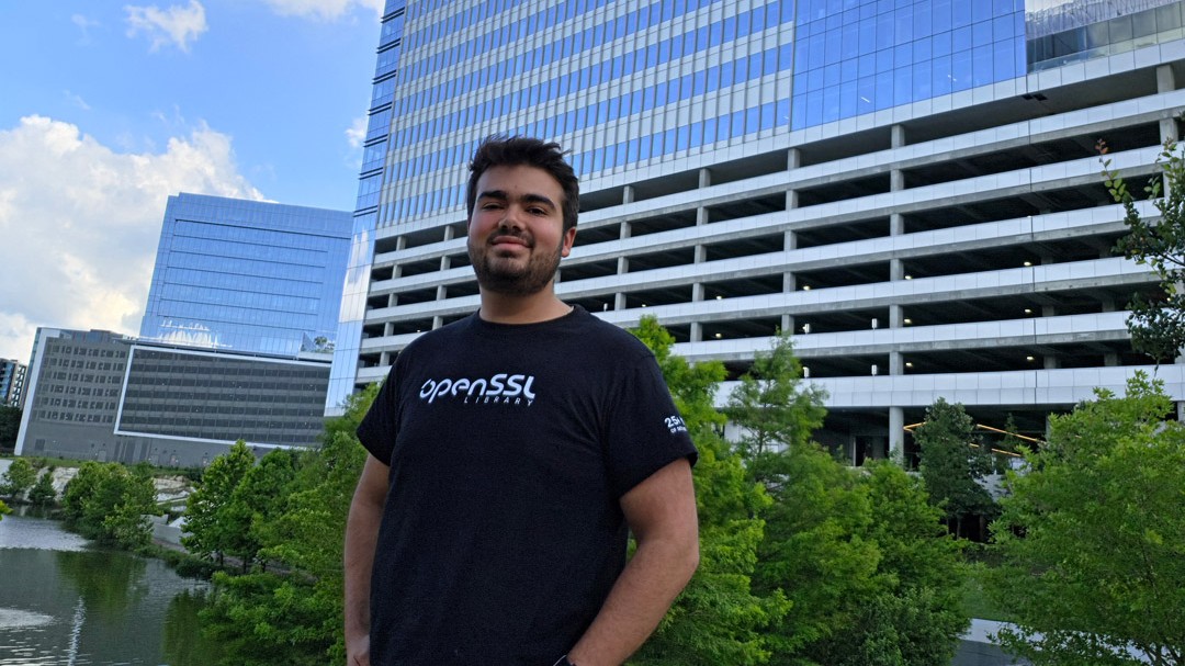   Jose Luis Gonzalez took a cybersecurity course that allowed him to help improve the security-critical open-source software library OpenSSL. He enjoys wearing the T-shirt that OpenSSL gave him at his Amazon job in Austin, Texas.
