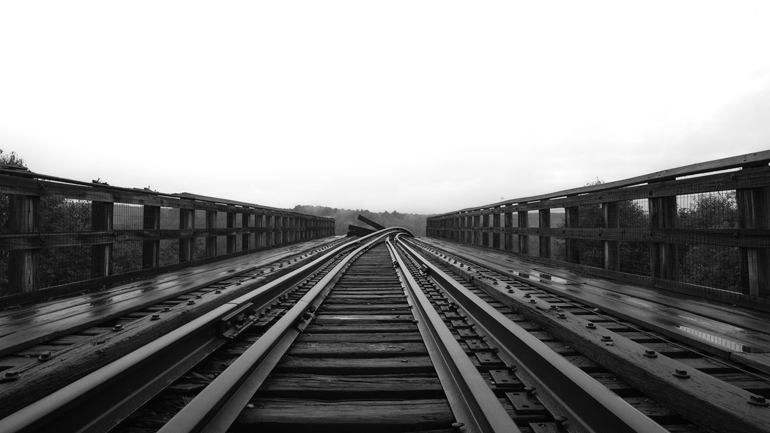 railroad tracks that veer severely downward.