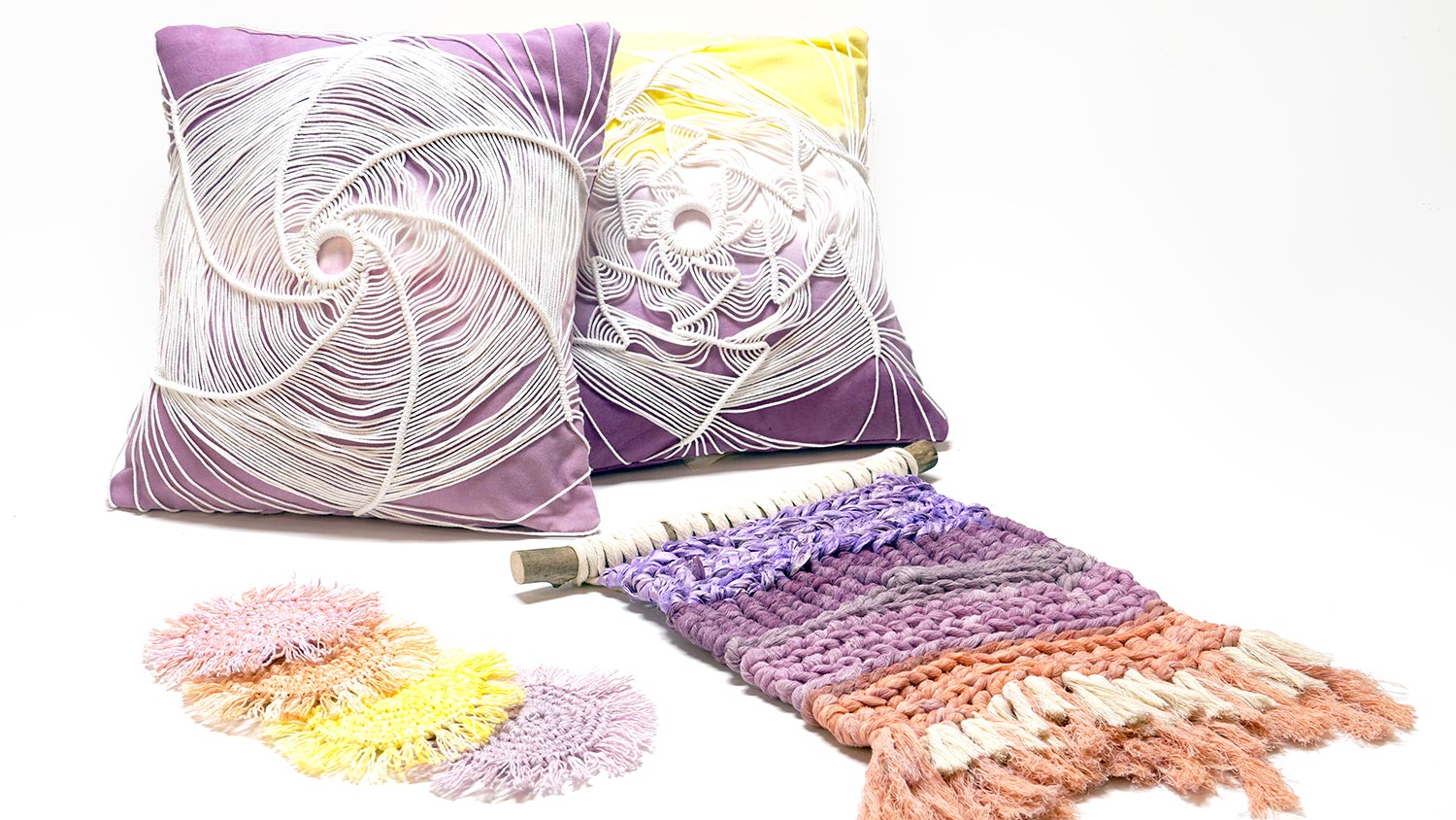 pillows and fabric decor with purples, yellows, and oranges.