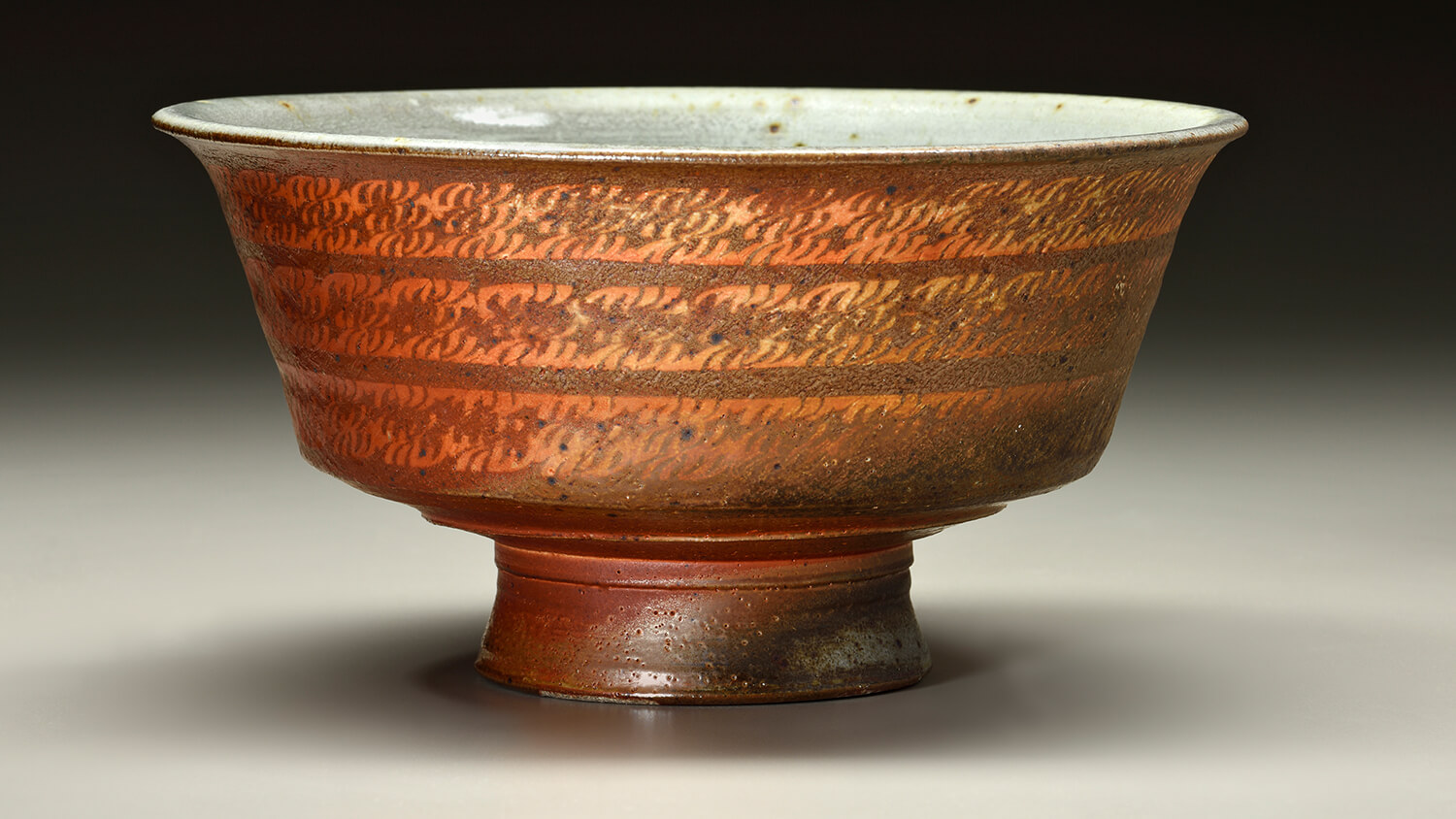 footed bowl with a brown mishima pattern.