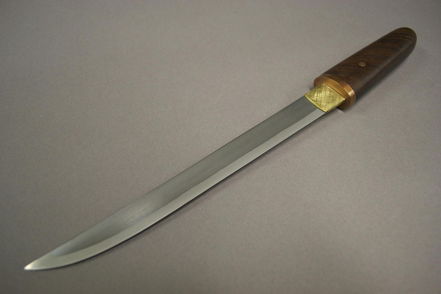 a knife with a wooden handle.
