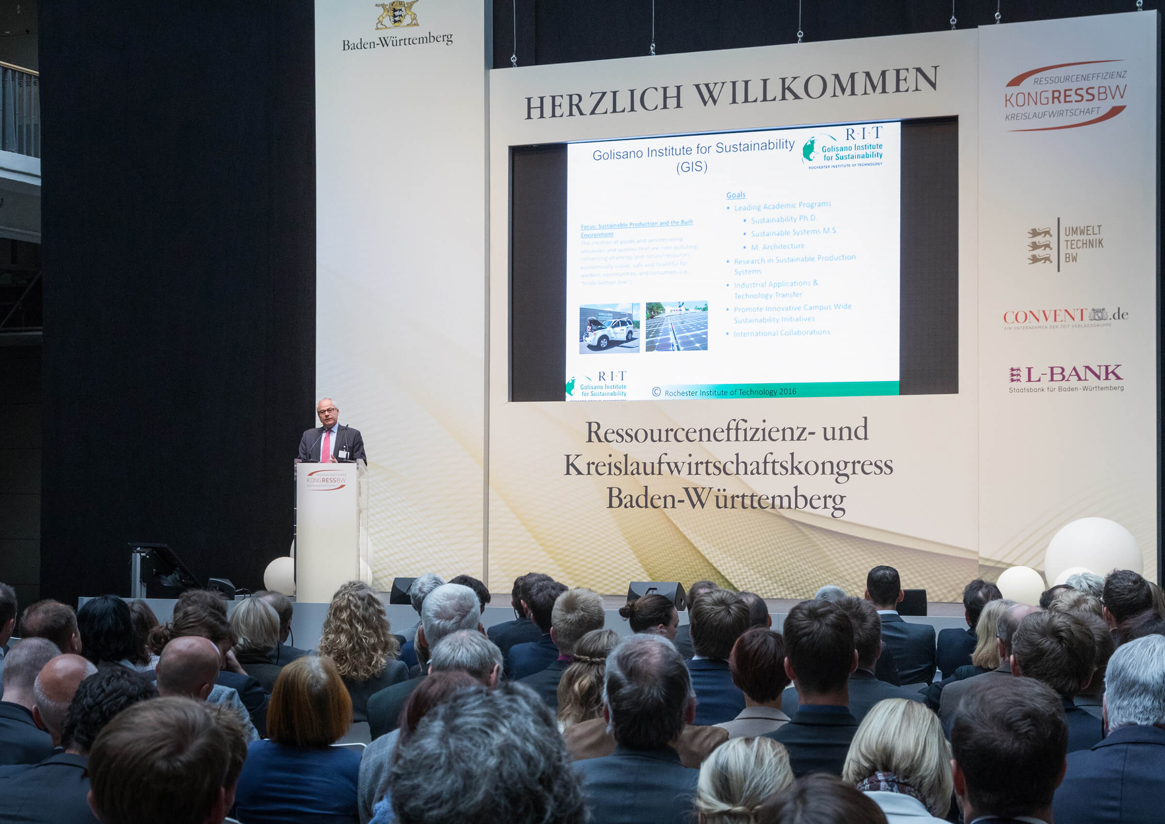 Nabil Nasr presenting at Karlsruhe to a room full of people.